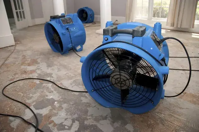 Air movers drying a floor in Torrance, CA